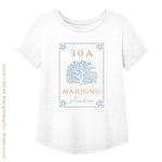 White t-shirt with 'Mahjong Studio' design featuring a tree and text on a white background. Artwork © 2026 30A Mahjong Holdings LLC. All rights reserved.