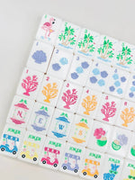 The Palm Royale Mahjong Tile Set and Mat and Shufflers