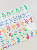 The Palm Royale Mahjong Tile Set and Mat and Shufflers