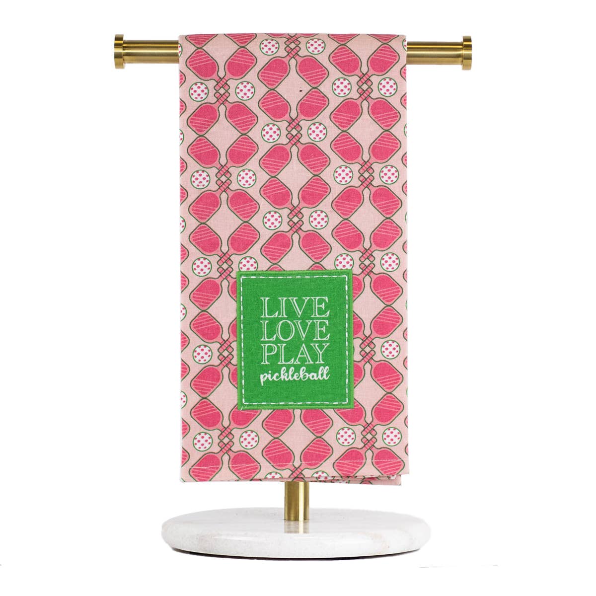 Decorative towel with pink pattern and 'Live Love Play Pickleball' text on a stand.
