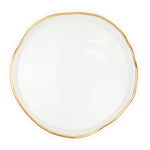 White plate with a gold rim on a white background