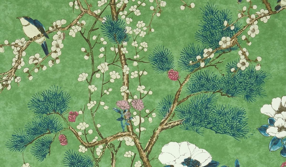 Decorative fabric with floral and bird pattern on a green background